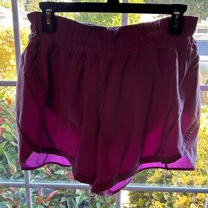 Lululemon purple panty lined athletic shorts with 1 zippered side pocket. EUC.